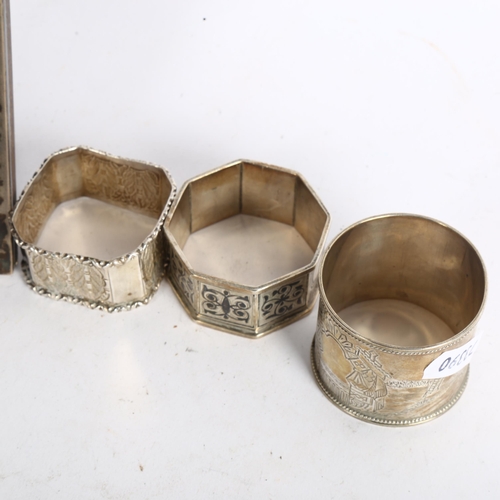 1112 - 3 decorative silver napkin rings, and a small rectangular silver-fronted photo frame (4)