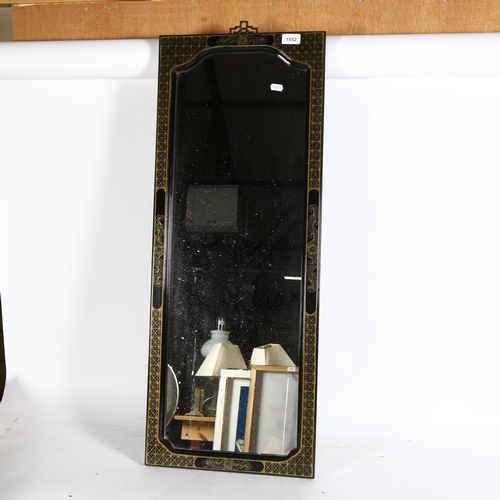 1852 - A Chinese style rectangular black lacquered rectangular wall mirror, 91cm x 36cm