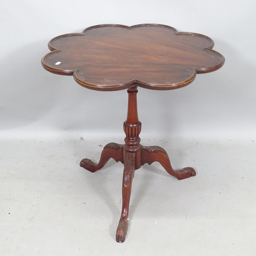 2193 - A reproduction Georgian style mahogany tilt-top table, with scalloped edge, bird cage movement, on t... 