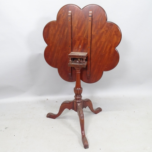 2193 - A reproduction Georgian style mahogany tilt-top table, with scalloped edge, bird cage movement, on t... 