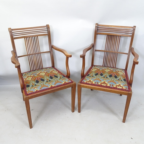 2195 - A pair of Arts and Crafts mahogany open armchairs, in the manner of Liberty & Co