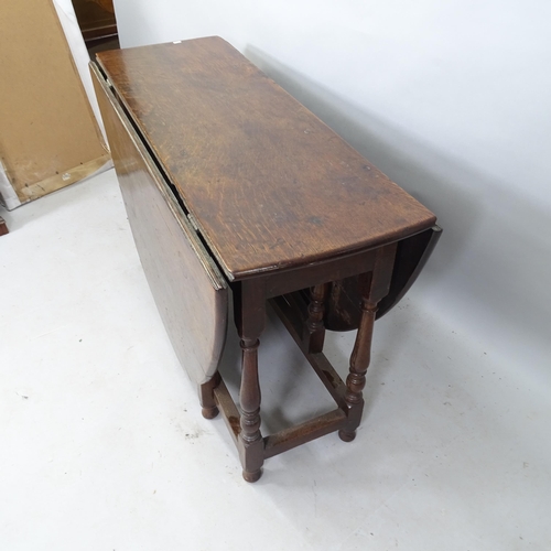 2212 - An Antique oak oval gateleg dining table, 120cm x 74cm x 46cm