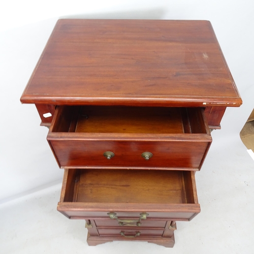 2220 - A reproduction mahogany chest of 7 drawers, with 2 turned pilasters, brass mounts, on bracket feet, ... 