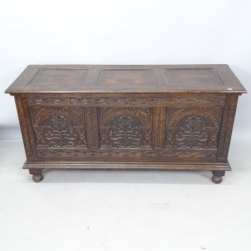 2226 - An Antique oak coffer with carved decoration, 150cm x 75cm x 52cm