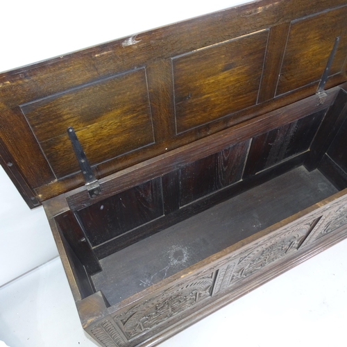 2226 - An Antique oak coffer with carved decoration, 150cm x 75cm x 52cm