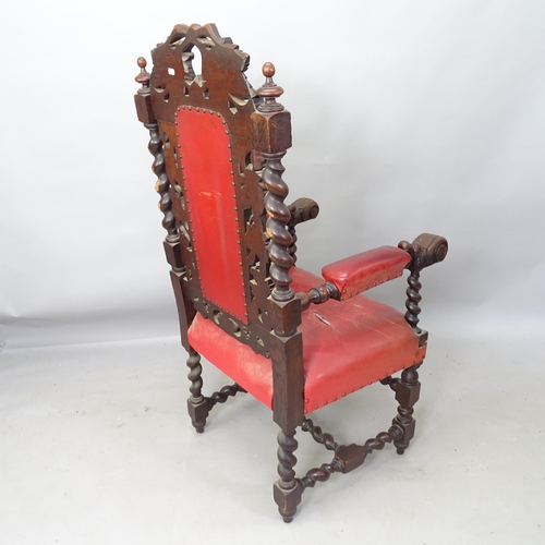 2233 - A 17th century style carved oak and leather upholstered throne chair