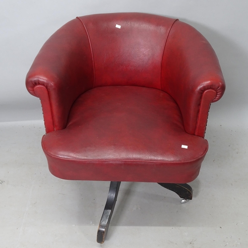 2234 - An early 20th century red leather upholstered swivel desk chair