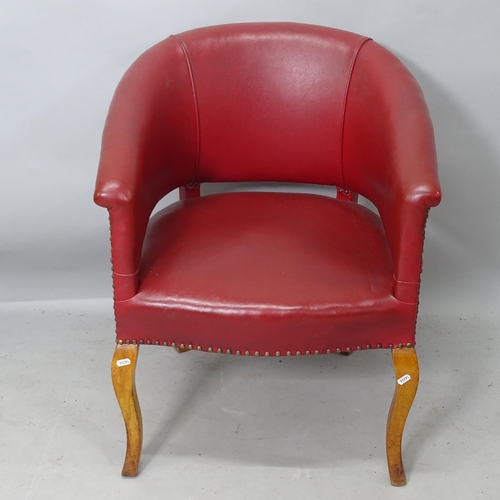 2235 - A 20th century style oak and red studded leather upholstered tub chair