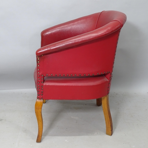 2235 - A 20th century style oak and red studded leather upholstered tub chair