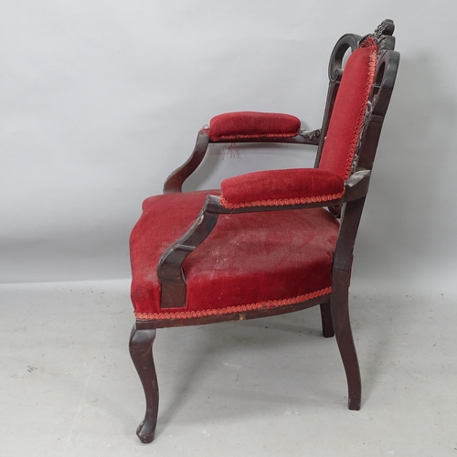 2236 - An Antique ebonised and upholstered open armchair, with carved decoration