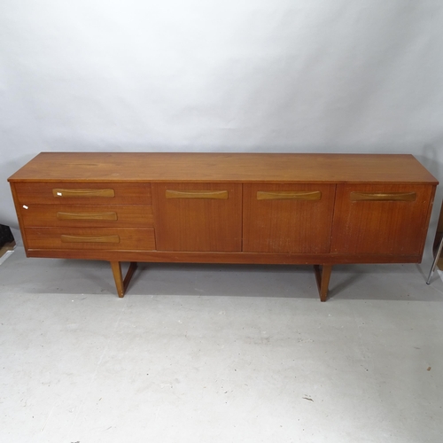 2242 - A mid-century teak low sideboard, with 3 fitted drawers and 3 cupboards, 205cm x 72cm x 42cm