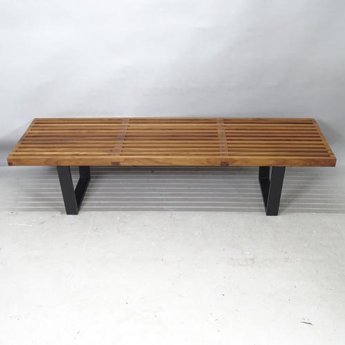 2243 - A mid-century design slatted walnut bench, in the manner of George Nelson