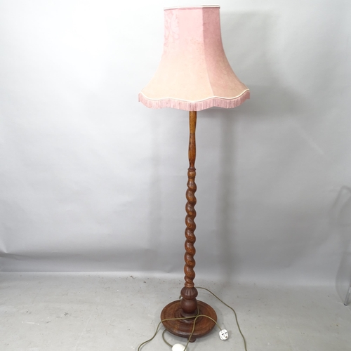 2245 - An oak standard lamp with barley twist column, height to bayonet 150cm