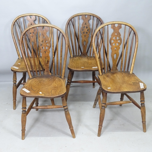 2253 - A set of 4 wheel-back elm-seated dining chairs