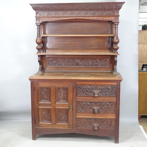 2260 - An Antique oak 2-section dresser, the lower section having a single carved and panelled door and 3 f... 