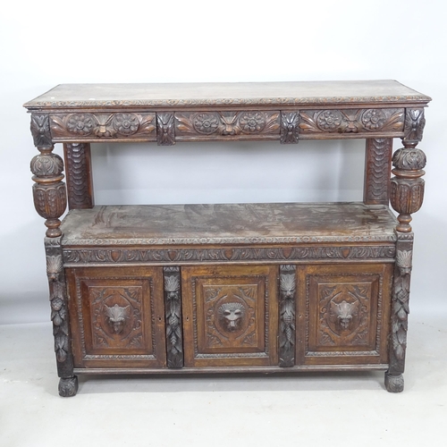 2261 - An Antique oak 2-tier buffet, with 3 fitted drawers and 3 cupboards under, and allover carved decora... 