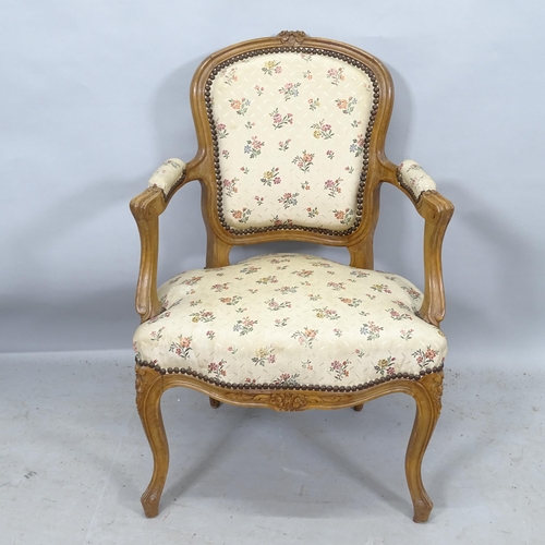 2273 - A French oak and upholstered open armchair