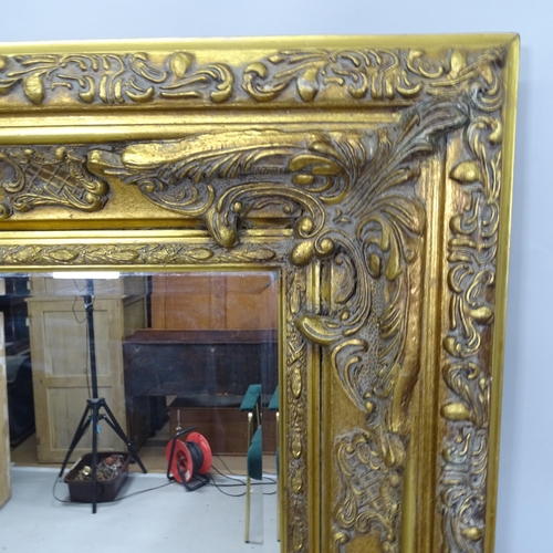 2308 - A contemporary gilt-framed bevel-edge wall mirror, 130cm x 160cm