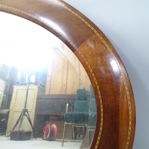 2317 - An Edwardian mahogany and satinwood inlaid oval mirror, 93cm x 63cm