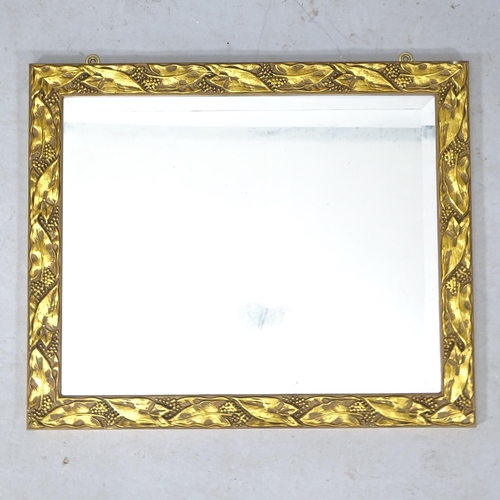 2318 - A small composite gilded wall mirror, 59cm x 49cm