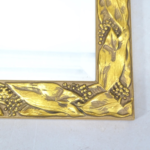 2318 - A small composite gilded wall mirror, 59cm x 49cm