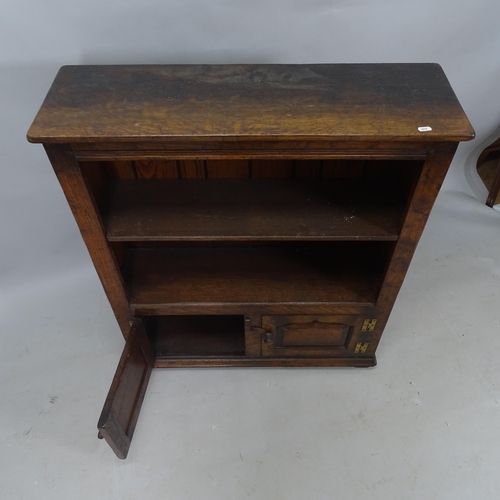 2324 - A stained oak open bookcase, with single adjustable shelf and cupboards under, 84cm x 97cm x 27cm