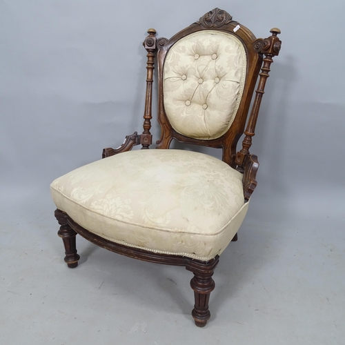 2327 - A 19th century mahogany and button-back upholstered nursing chair, with carved decoration