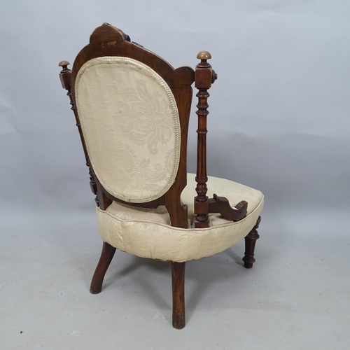 2327 - A 19th century mahogany and button-back upholstered nursing chair, with carved decoration