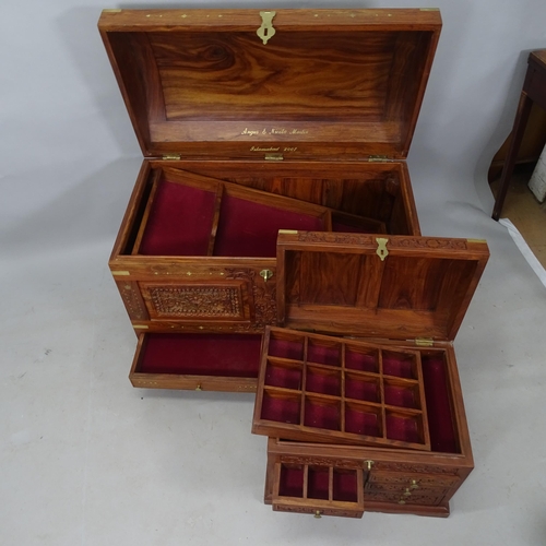 2328 - A large Anglo-Indian hardwood and brass inlaid chest, with allover carved decoration, tray fitted in... 