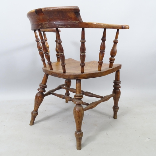 2336 - A 19th century elm-seated smoker's bow-arm chair