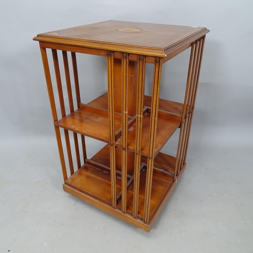 2341 - A  burr-walnut veneered revolving bookcase, 50cm x 81cm x 49cm