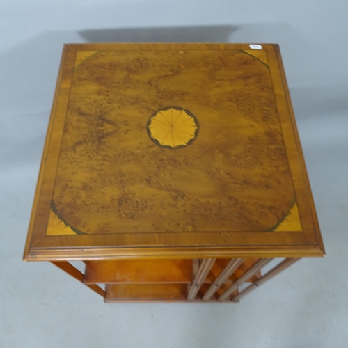 2341 - A  burr-walnut veneered revolving bookcase, 50cm x 81cm x 49cm