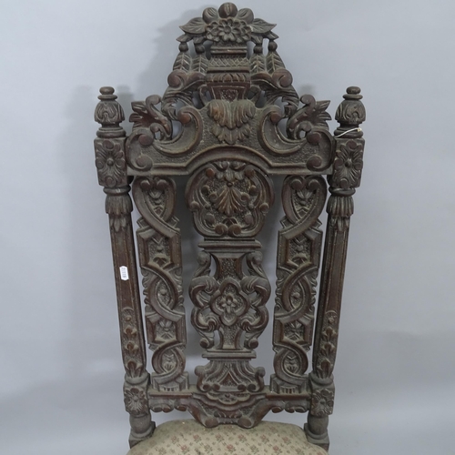 2345 - A 19th Century Carolean style hall chair, with carved and pierced back