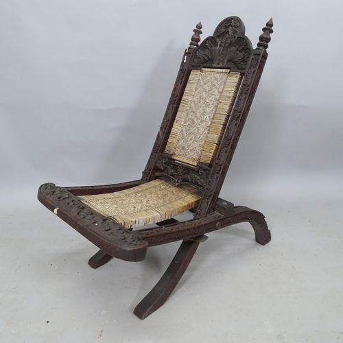 2346 - An early 20th Century folding low chair, with wicker woven seat