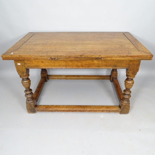 2553 - A 19th century oak draw leaf dining table, on turned legs, with all round stretcher, 136cm (extendin... 