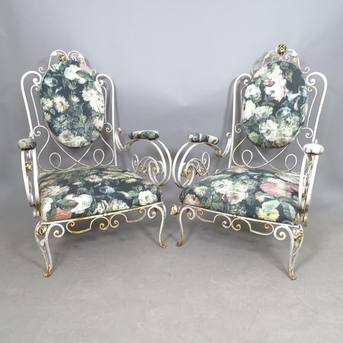 2562 - A pair of mid-century French wrought-iron conservatory lounge chairs, with scroll arms, in the manne... 