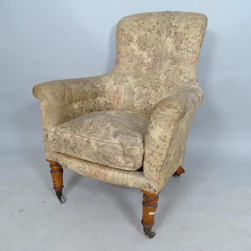 2572 - An Antique walnut and upholstered rollover armchair