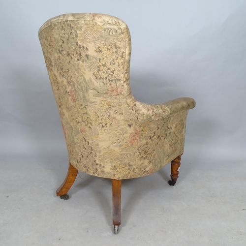 2572 - An Antique walnut and upholstered rollover armchair