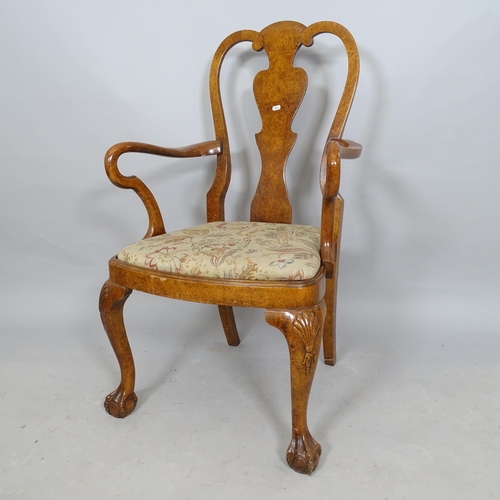 2574 - A Continental style walnut open arm chair, with splat back and cabriole legs