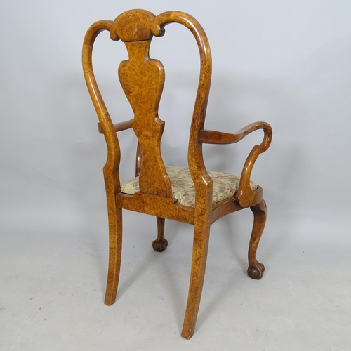 2574 - A Continental style walnut open arm chair, with splat back and cabriole legs