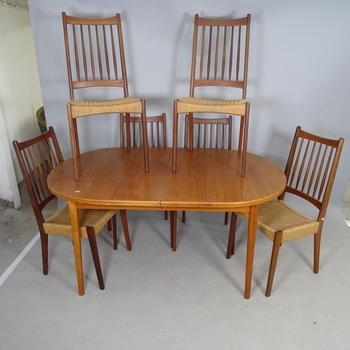 2582 - A mid-century teak oval draw-leaf dining table, 154 x 74 x 100cm, and 6 matching rush-seated dining ... 