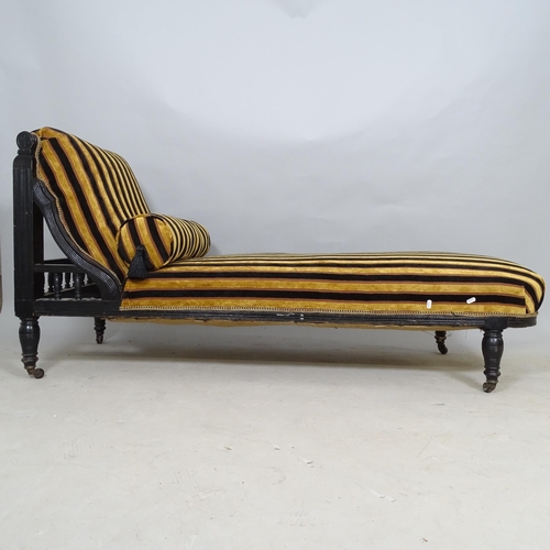 2596 - A Victorian upholstered and ebonised chaise longue, 160 x 78 x 65cm