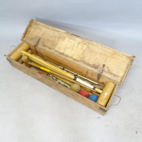 2598 - A Vintage 4-player croquet set, in pine box