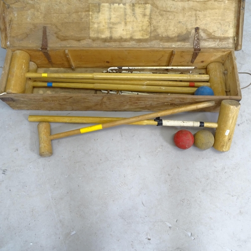 2598 - A Vintage 4-player croquet set, in pine box