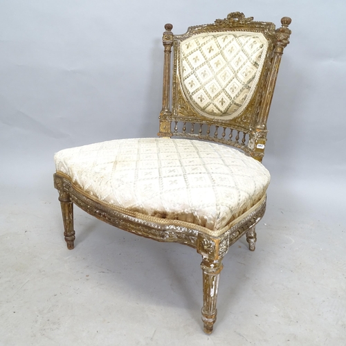 2609 - An Antique giltwood framed and upholstered parlour chair, with carved decoration