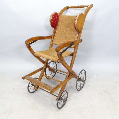 2622 - A mid-century mahogany folding pushchair, 60cm x 90cm x 48cm