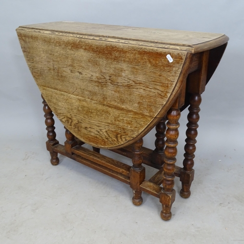 2628 - An Antique oak oval gateleg drop leaf table, 90cm x 75cm x 28cm