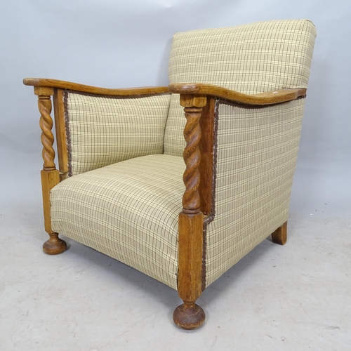 2632 - A 1920s oak and upholstered armchair, with barley twist decoration