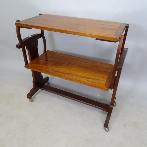 2644 - A mid-century mahogany metamorphic table, on wheeled base, 88cm x 86cm x 38cm