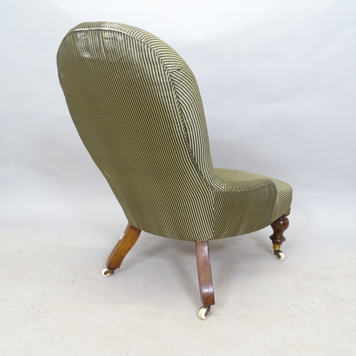 2608 - A Victorian button-back upholstered nursing chair, raised on mahogany legs